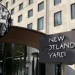 teens throw signs at police in london riot