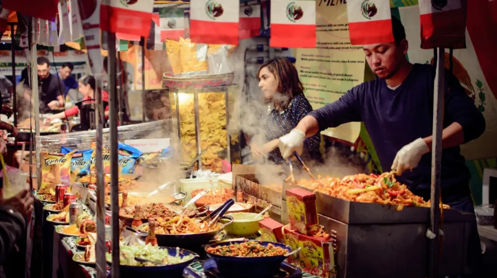 How does Camdens street food reflect its cultural and commercial history