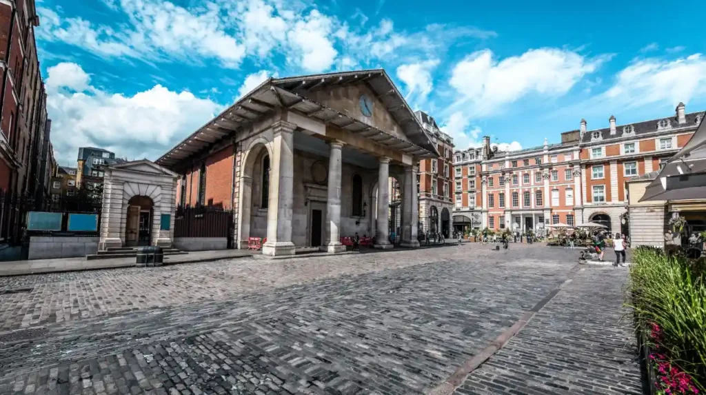 What historic buildings and architectural features survive in Covent Garden today